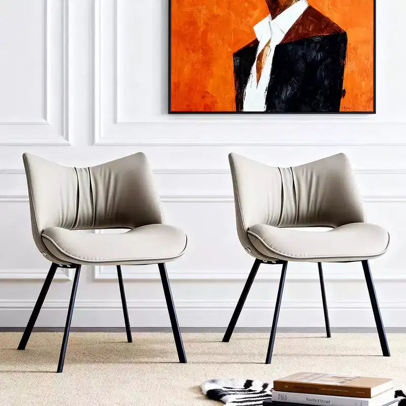 Chaise de salle à manger chic et moderne, rembourrée, avec dossier incurvé et pieds en métal noir - Gris clair