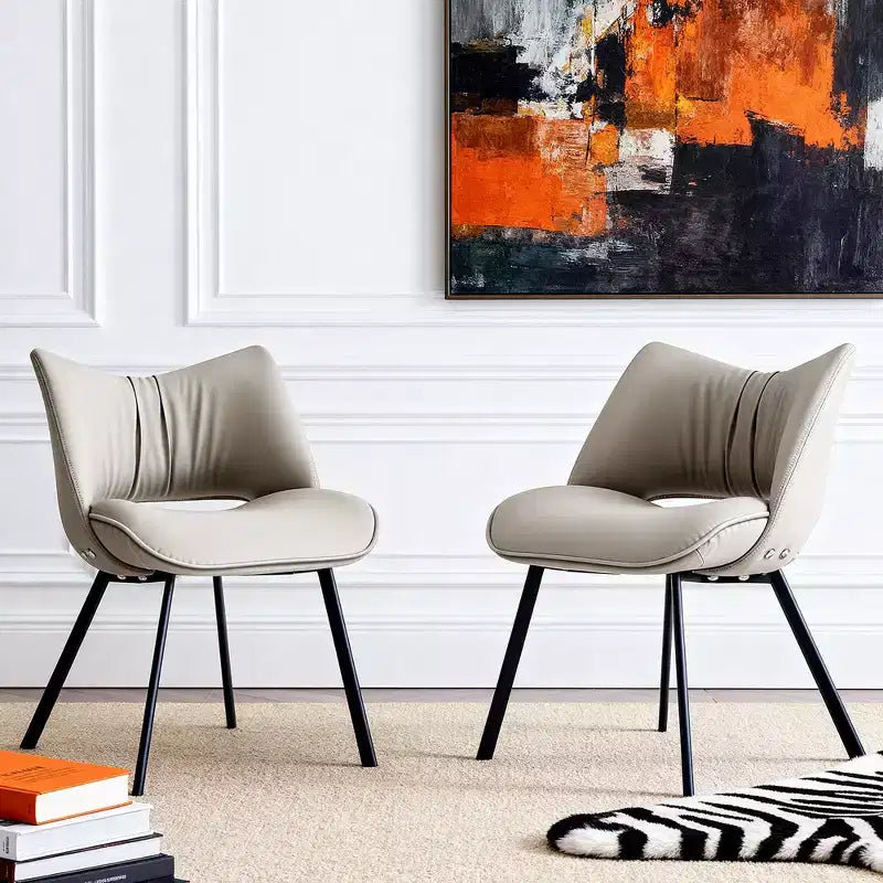 Chaise de salle à manger chic et moderne, rembourrée, avec dossier incurvé et pieds en métal noir - Gris clair